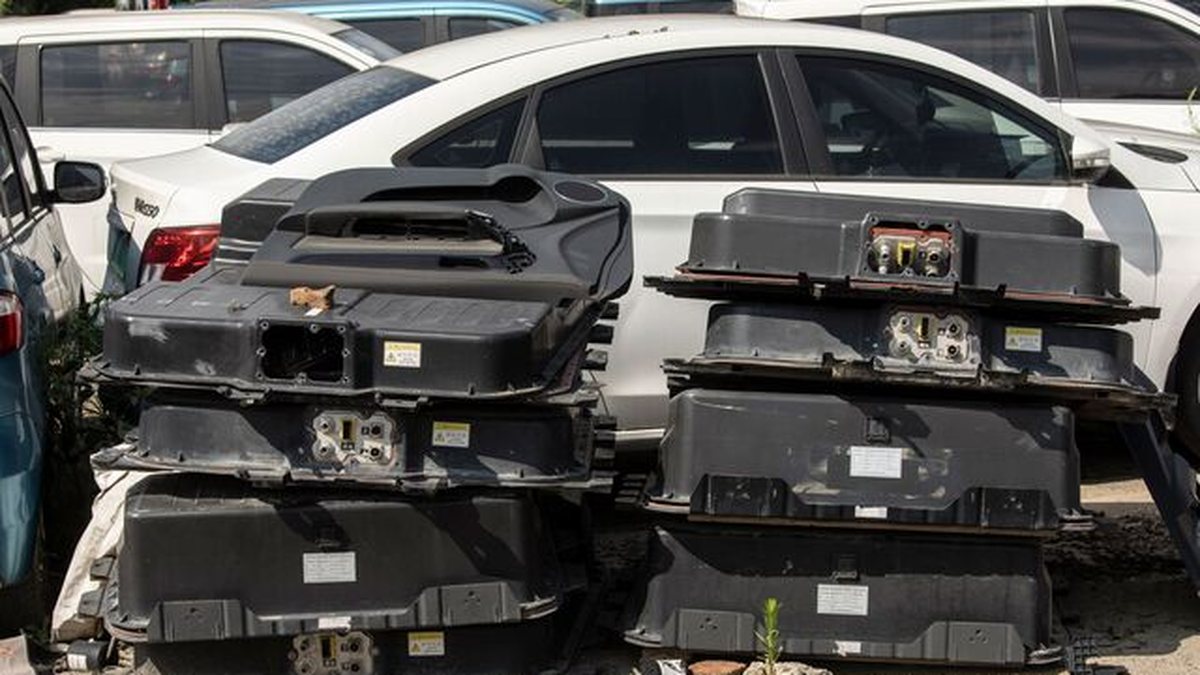 EV battery packs stacked at a UK breaker's yard